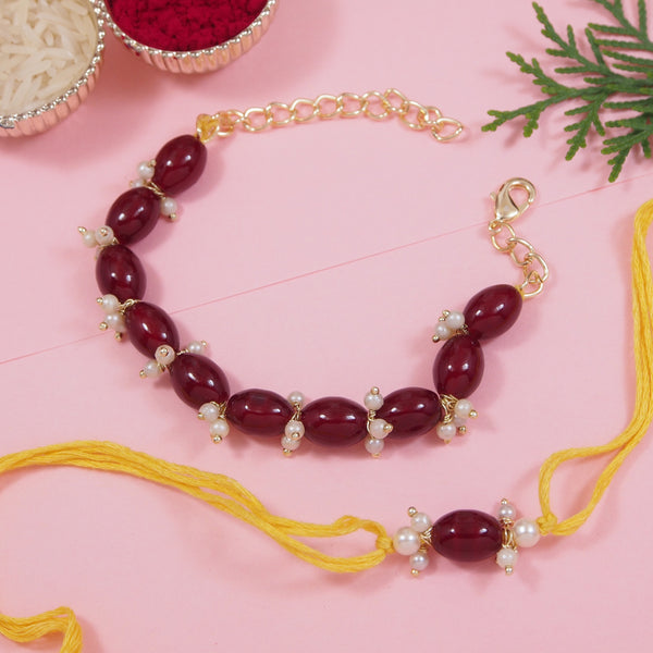 Elegant Bhaiya Bhabhi Maroon Lumba Pearl & Rakhi With Roli Chawal &Card