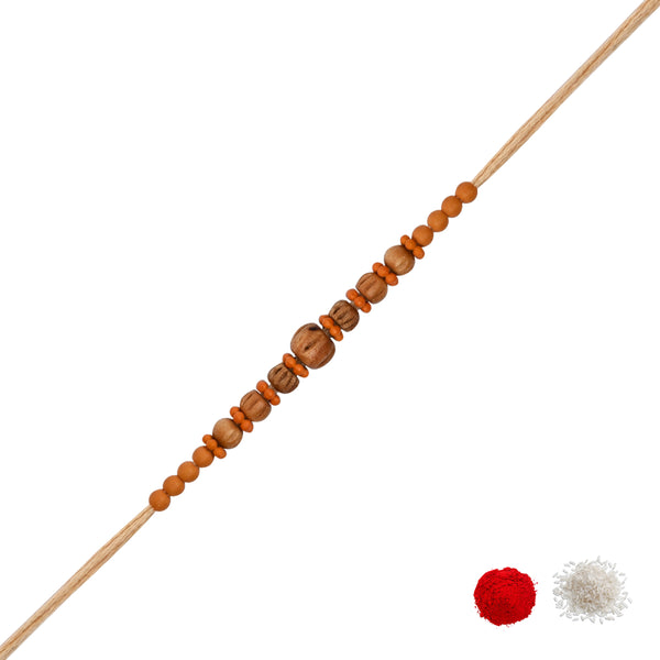 DELICATE PEARL WOOD RAKHI WITH ROLI CHAWAL & RAKSHABANDHAN CARD