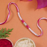 DELICATE Pink PEARL BEADED RAKHI WITH ROLI CHAWAL & RAKSHABANDHAN CARD