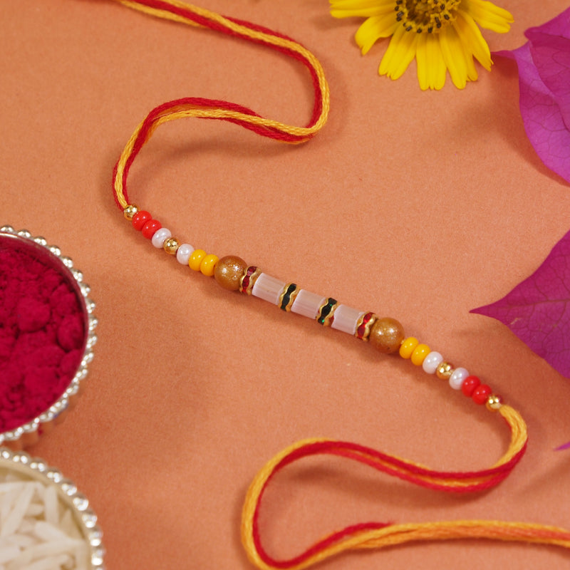 DELICATE PEARL BEADED RAKHI WITH ROLI CHAWAL & RAKSHABANDHAN CARD