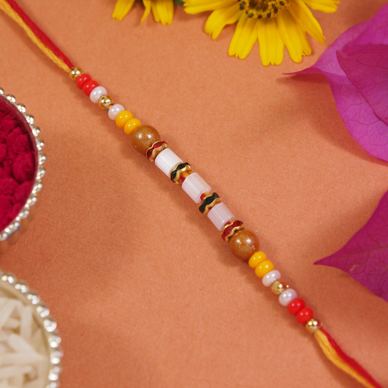 DELICATE PEARL BEADED RAKHI WITH ROLI CHAWAL & RAKSHABANDHAN CARD