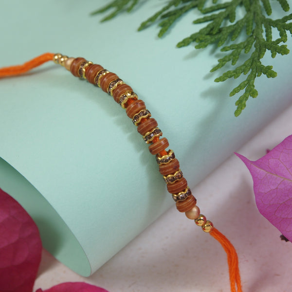 DELICATE PEARL BEADED RAKHI WITH ROLI CHAWAL & RAKSHABANDHAN CARD