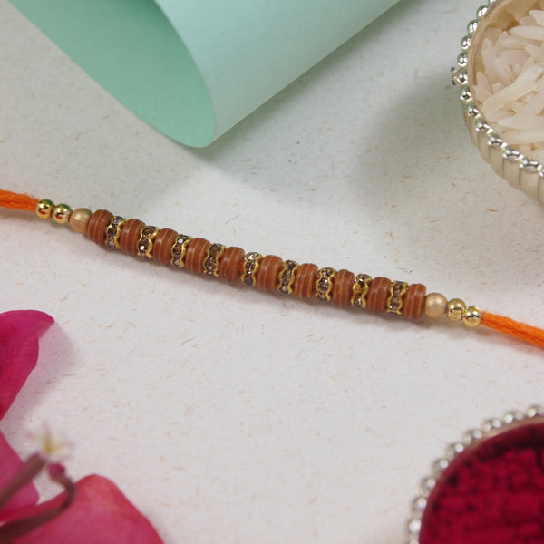 DELICATE PEARL BEADED RAKHI WITH ROLI CHAWAL & RAKSHABANDHAN CARD