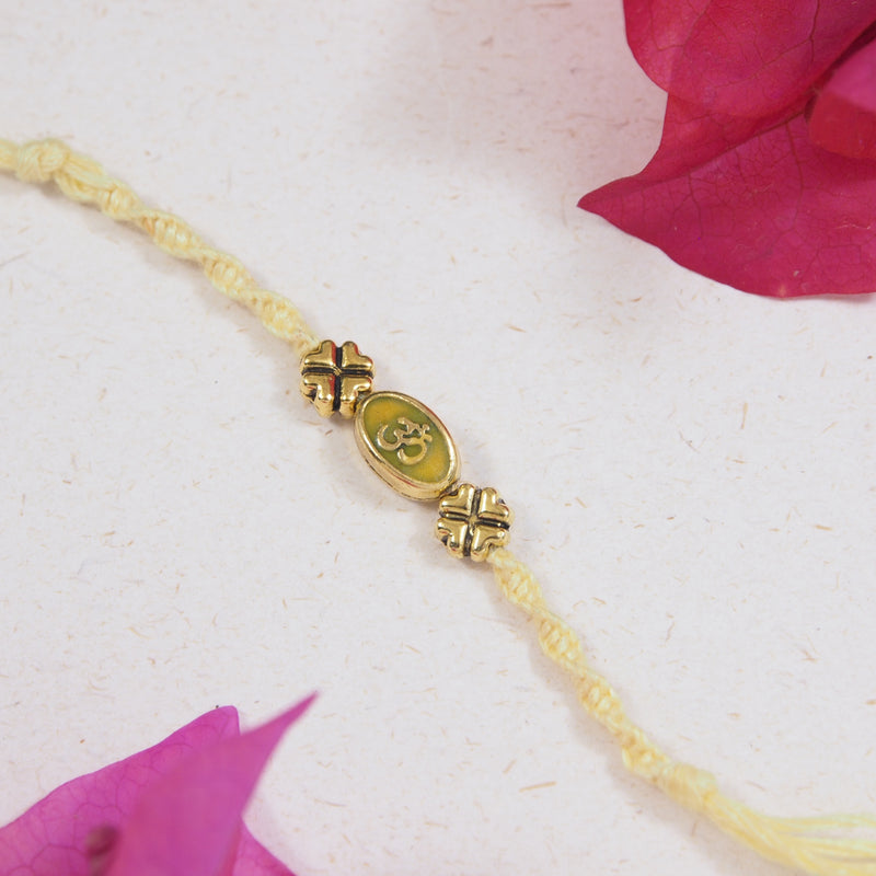 Om Yellow Enamel Rakhi