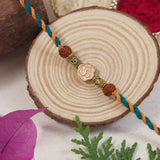 Om Peach Enamel Pearl Beaded Rakhi