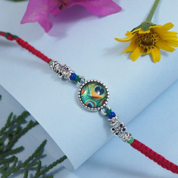 DELICATE PEARL BEADED Peacock RAKHI WITH ROLI CHAWAL & RAKSHABANDHAN CARD