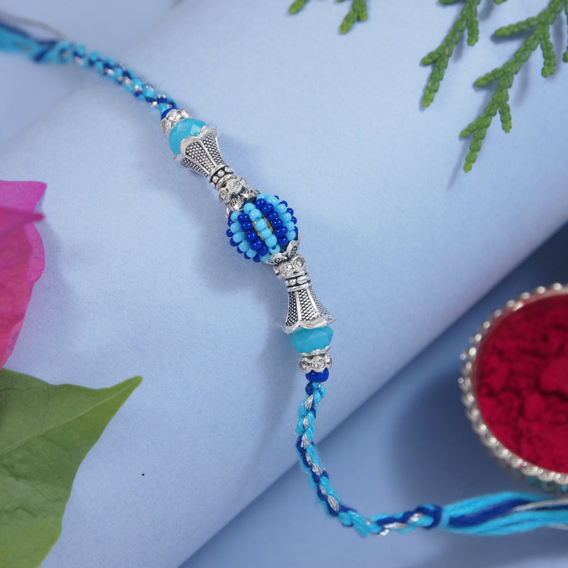 DELICATE PEARL BEADED Blue RAKHI WITH ROLI CHAWAL & RAKSHABANDHAN CARD