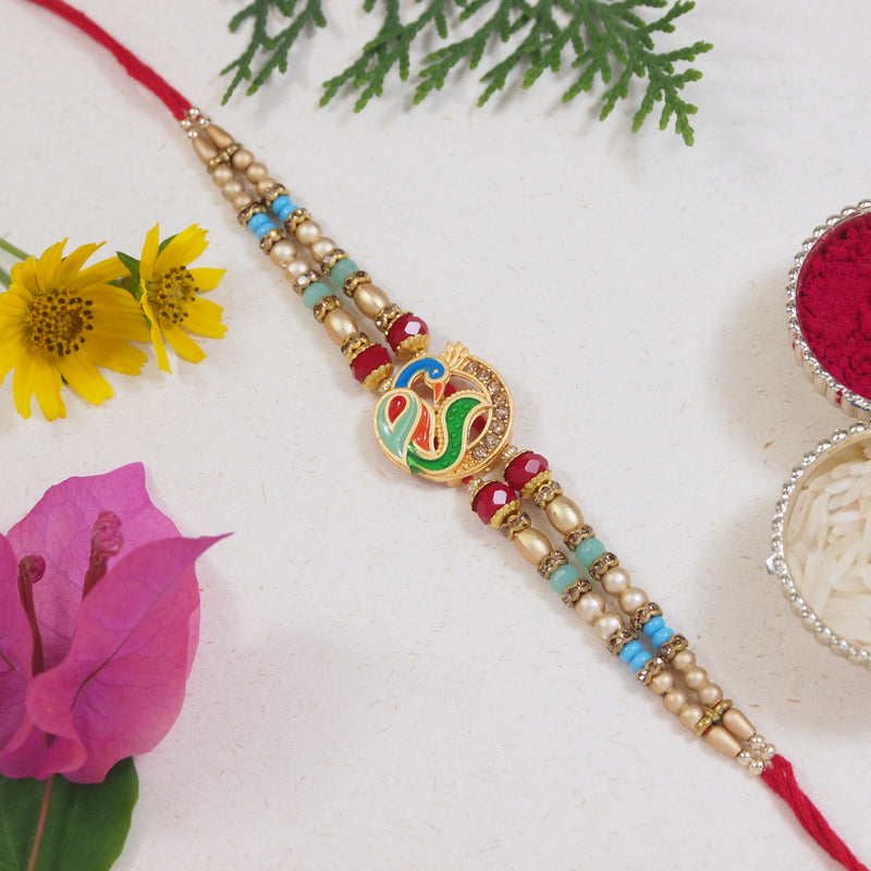 DELICATE PEARL BEADED Peacock RAKHI WITH ROLI CHAWAL & RAKSHABANDHAN CARD